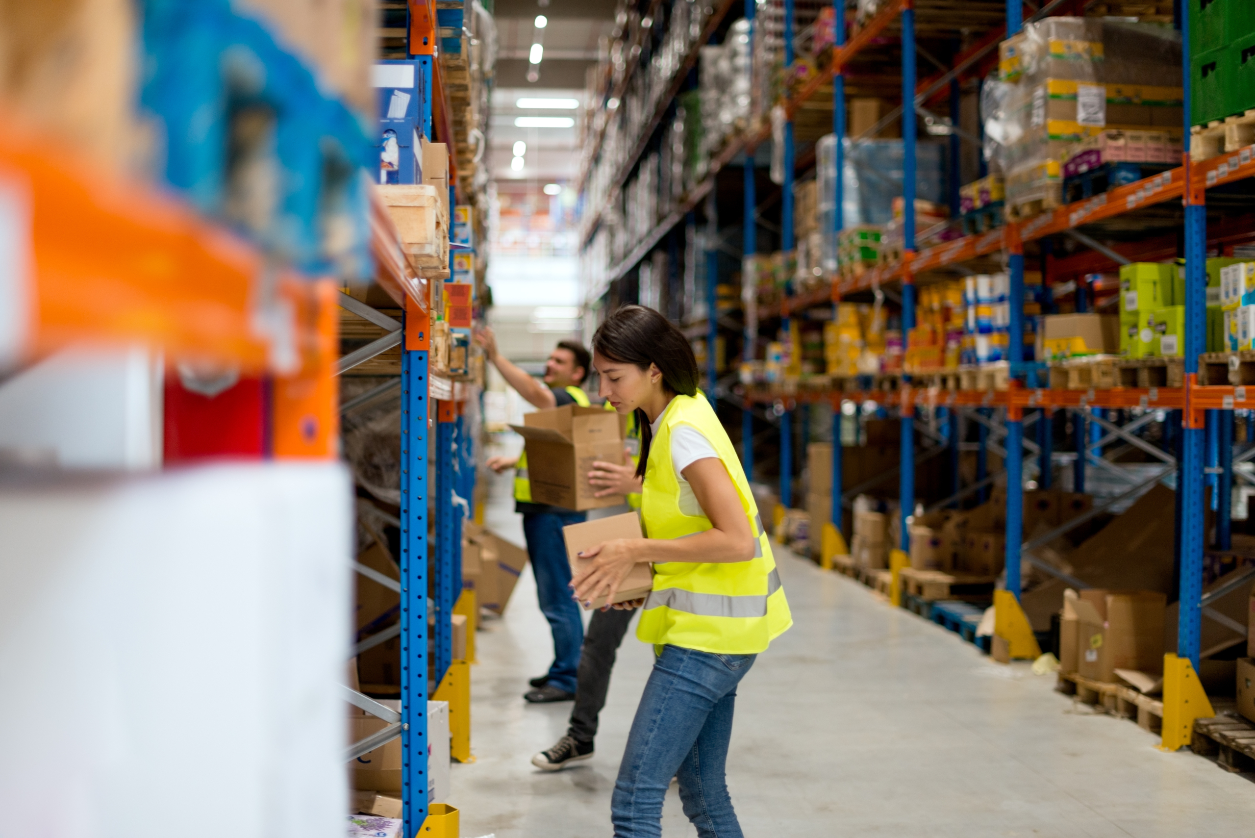 warehouse workers stocking shelves