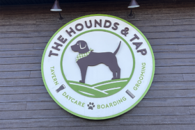 The Hounds & Tap sign above door