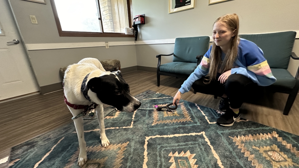 Jade the dog and her trainer